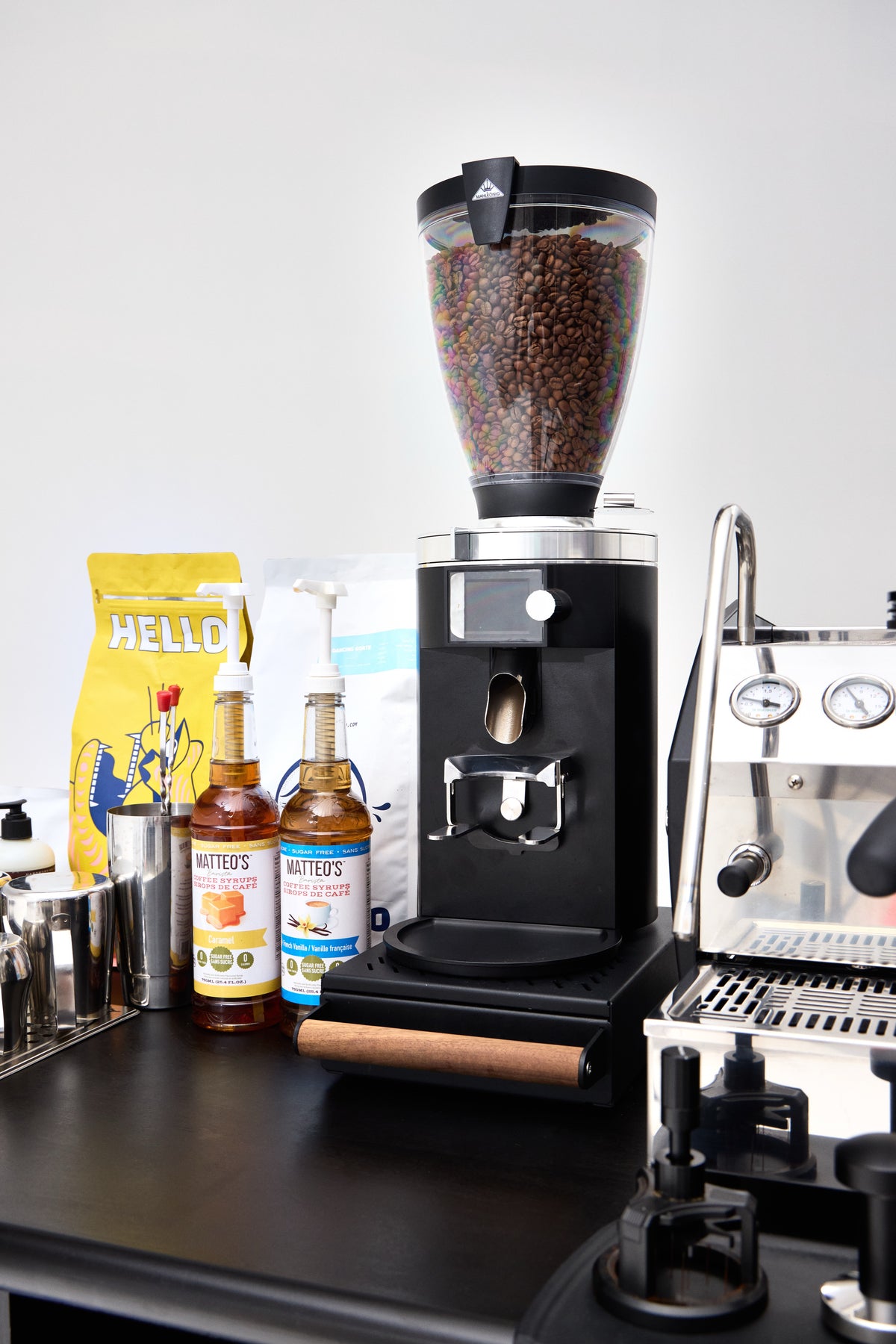 Grinder, syrups and beans on the cart